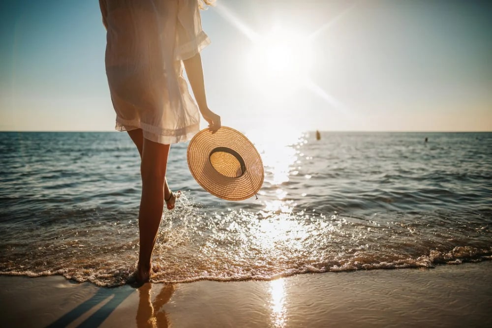 Womans-legs-splashing-water-on-the-beach
